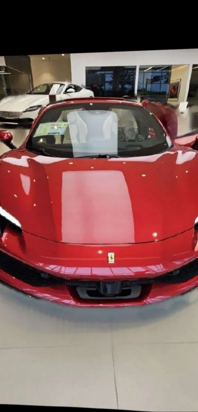 Red sports car in a modern showroom setting.