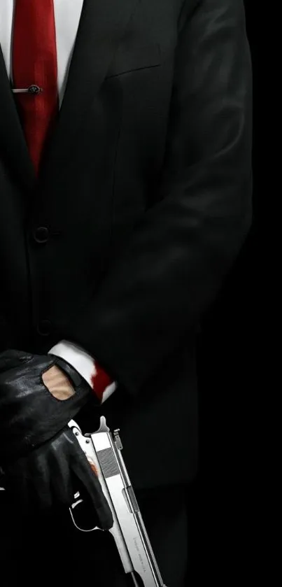 Mysterious man in black suit with a red tie and gloves holding a weapon.