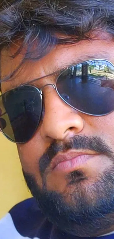 Close-up of a person wearing stylish sunglasses.