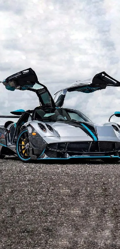 Sleek supercar with open doors and blue accents on asphalt.