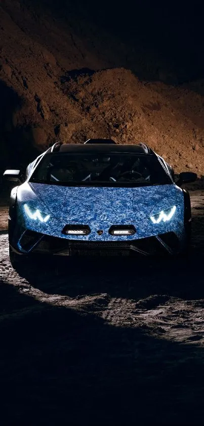 A sleek supercar illuminated in a dramatic night scene against rugged terrain.