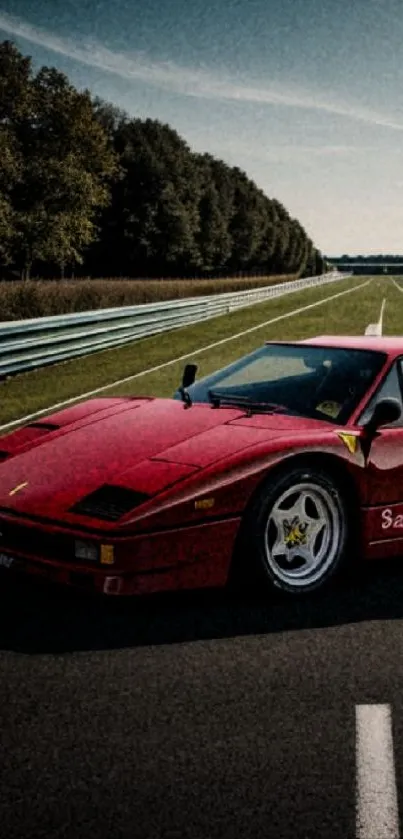 Red supercar on an open road under a clear sky.