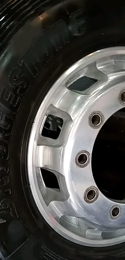 Close-up of a sleek Bridgestone tire with metallic details.