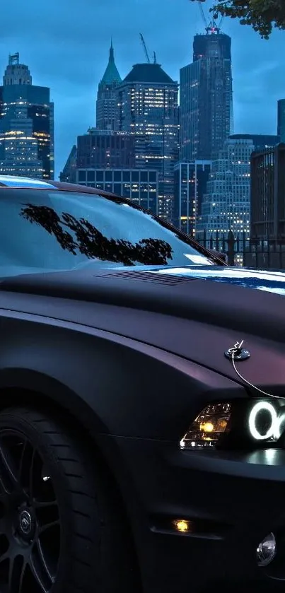 Sleek black car with cityscape backdrop under a night sky.