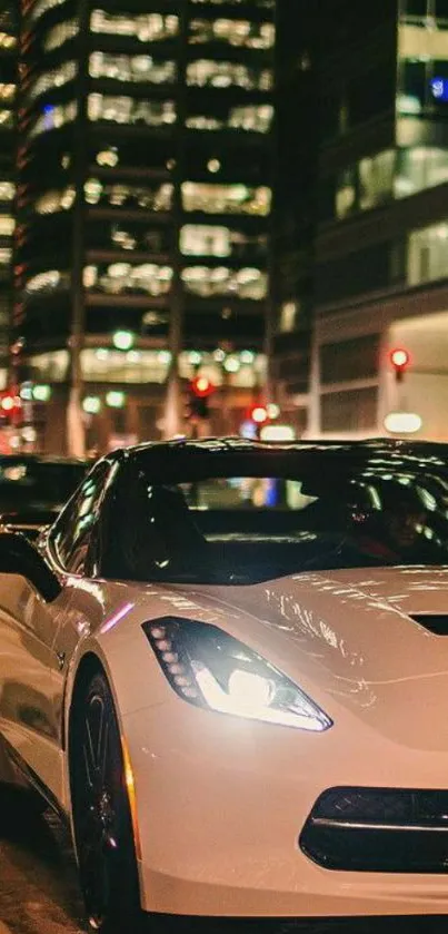 Sleek sports car on city street at night.