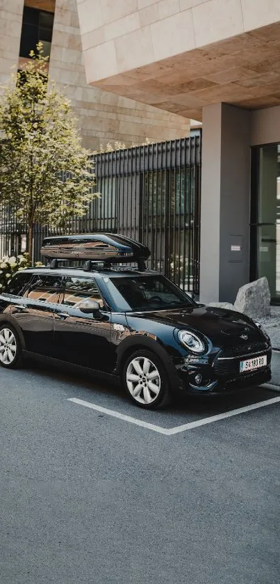 Modern black car in urban setting with sleek design.