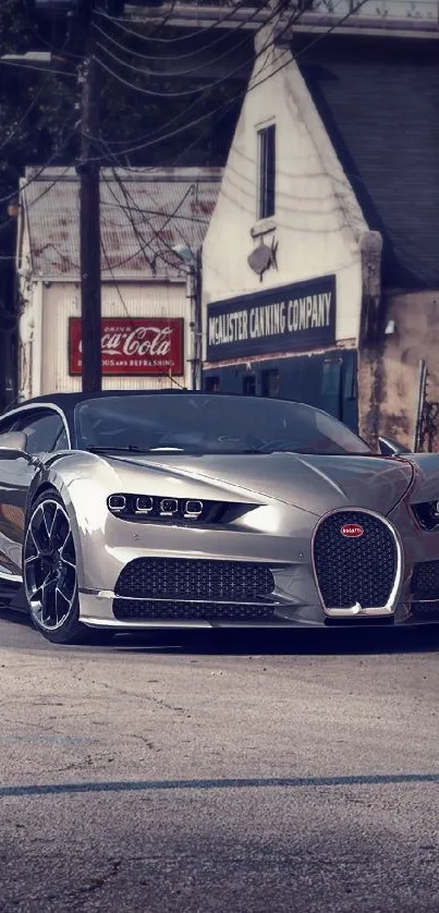 Sleek silver supercar parked in urban setting.