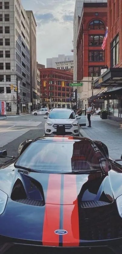 Sleek urban supercar with red stripe in city setting.