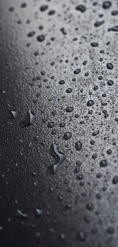 Dark surface with water droplets, sleek modern design.