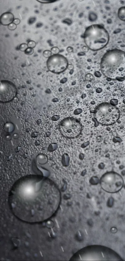 Realistic water droplets on a gray textured surface.