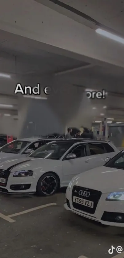 Sleek white cars in a gray garage, modern style.