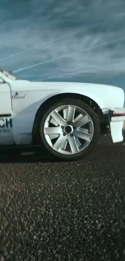 Sleek white racing car on open road, dynamic view.