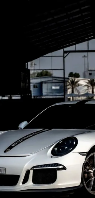 Sleek white sports car in a garage setting wallpaper.