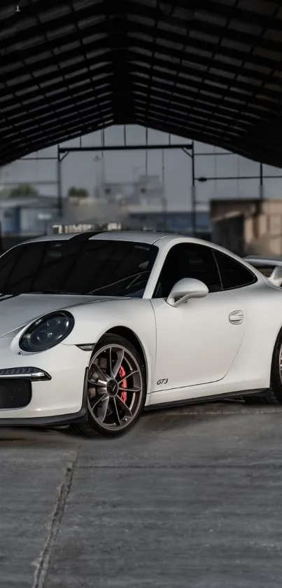 White sports car in an indoor setting with a sleek design.