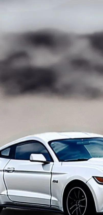 Sleek white sports car with cloudy sky backdrop.