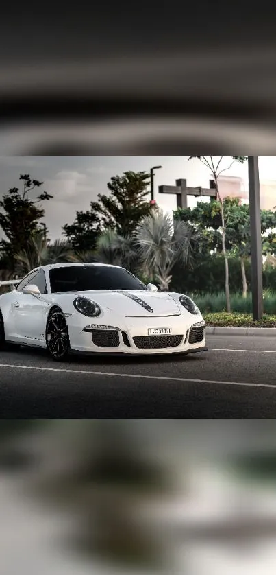 Sleek white sports car on an urban road.