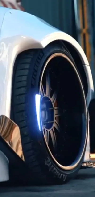 Close-up of a white sports car wheel with sleek design.