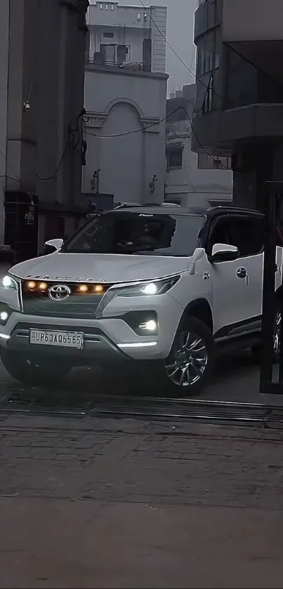 Sleek white SUV parked in a cityscape background.