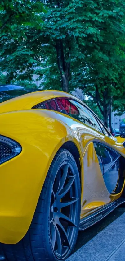 Sleek yellow sports car parked on a city street, perfect for mobile wallpaper.