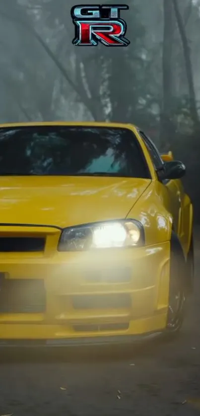 Vibrant yellow sports car in motion on a misty road.