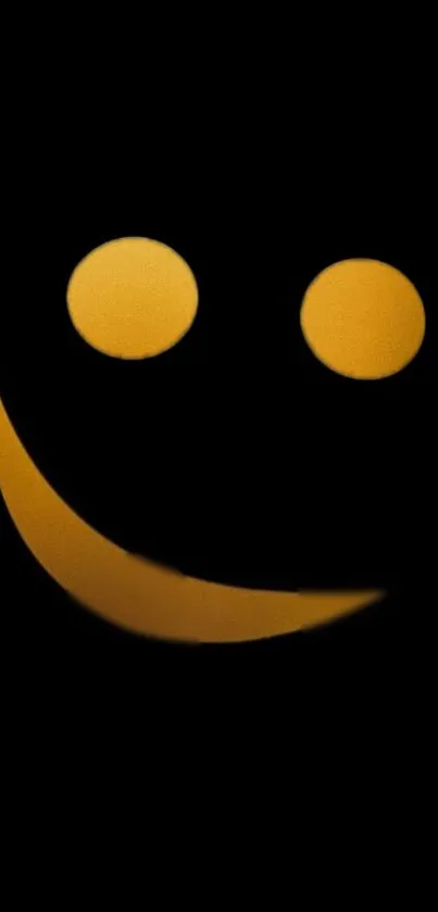 Minimalist smiley face on black wallpaper with yellow features.