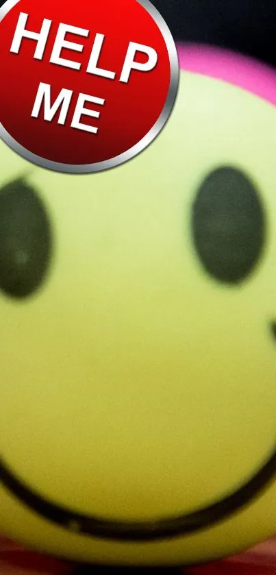 Yellow smiley face with 'Help Me' message on a phone wallpaper.