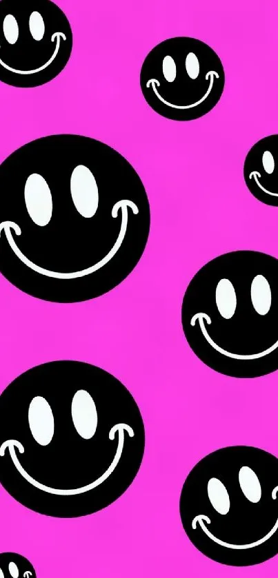 Pink background with black and white smiley faces.