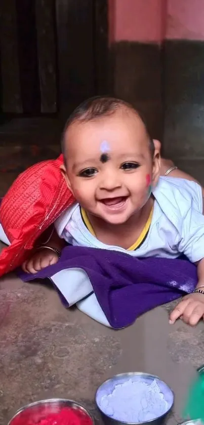 Smiling baby with colorful backdrop, joyful and playful.