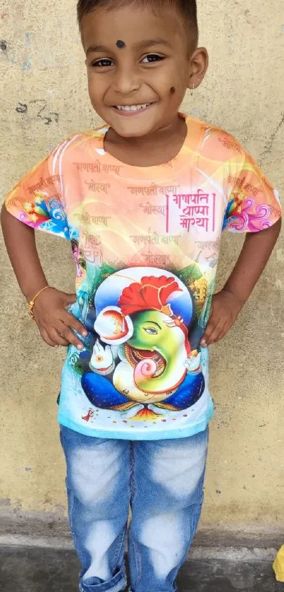 Happy child in vibrant Ganesh shirt