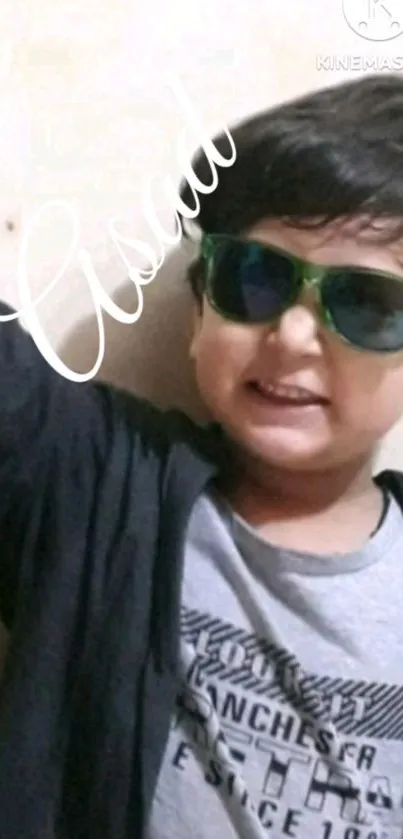Smiling child wearing sunglasses mobile wallpaper
