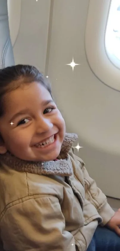 Smiling child sitting by airplane window seat.