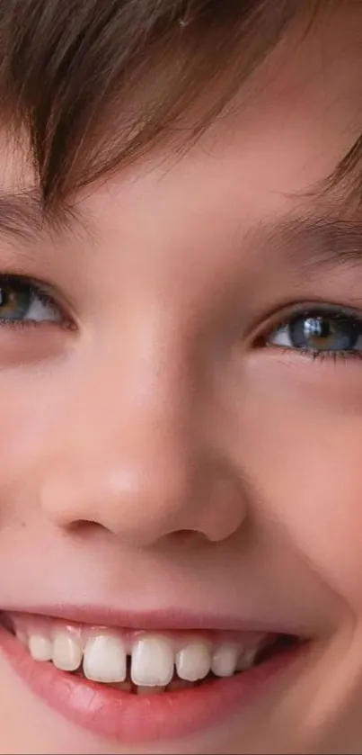 Portrait of a smiling child with brown hair and expressive eyes, ideal for phone wallpaper.