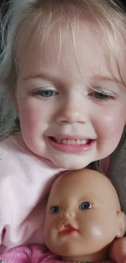 A child joyfully smiles while holding a doll.