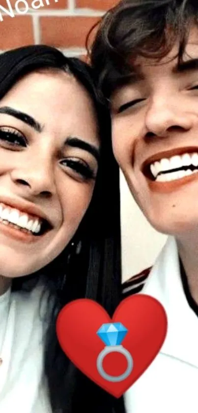 Smiling couple with red heart wallpaper.