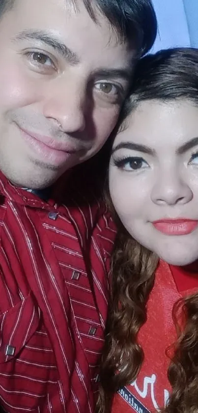 Happy couple smiling in red attire