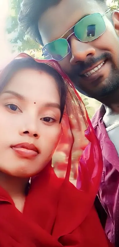 Smiling couple outdoor portrait in colorful attire.