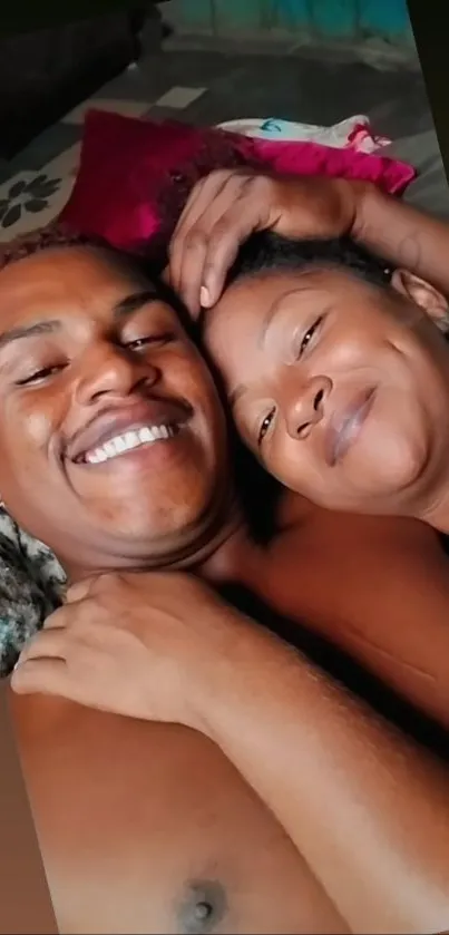 A smiling couple in a comfortable, relaxed pose, enjoying their time together.