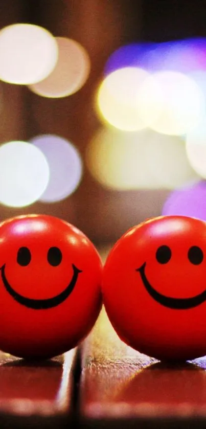 Two red smiling faces with bright bokeh background.