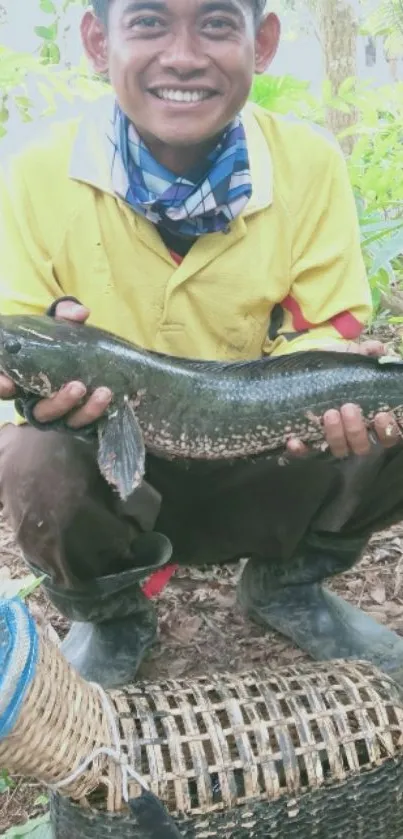 Smiling fisherman holding a catch in lush greenery background.