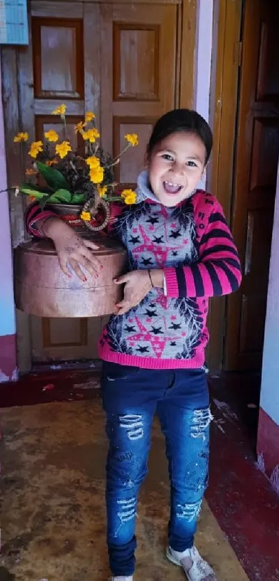 Joyful child holding flowers in a cozy home setting.