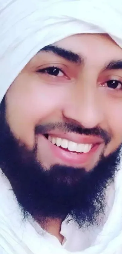 Smiling man with a white turban and beard as mobile wallpaper.