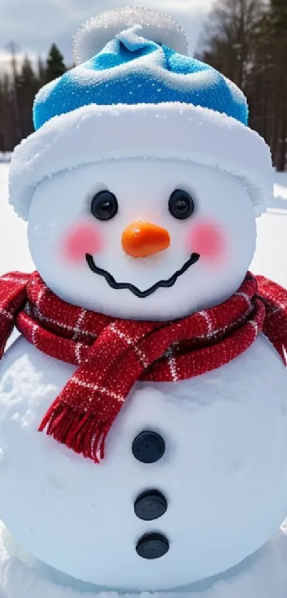 Cheerful snowman with blue hat and red scarf in snowy landscape.