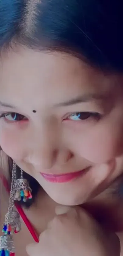 Close-up portrait of a smiling woman with jewelry.