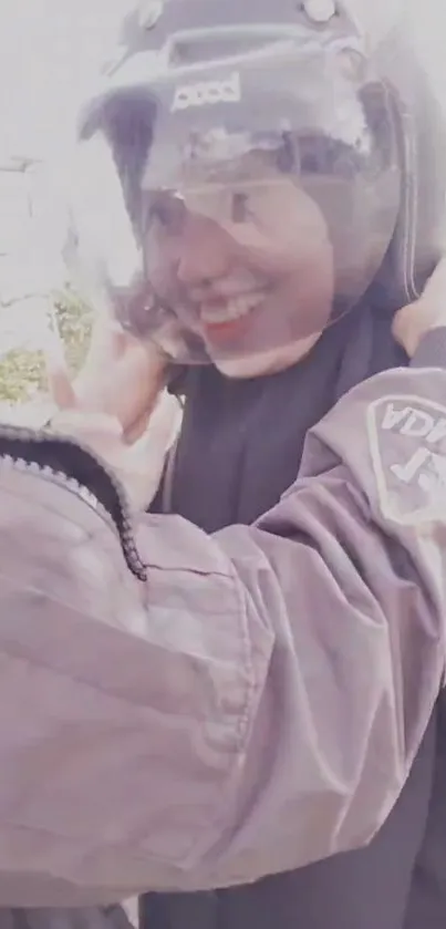 Smiling woman wearing helmet, close-up.