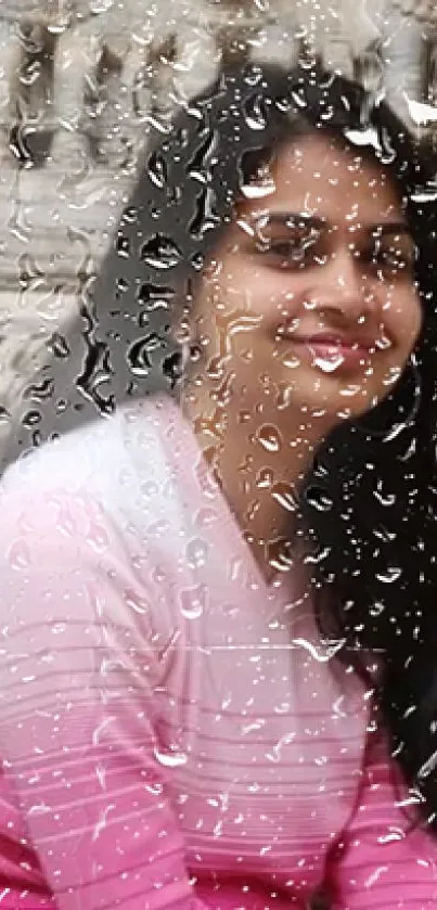 Smiling woman in pink shirt with stone carving backdrop