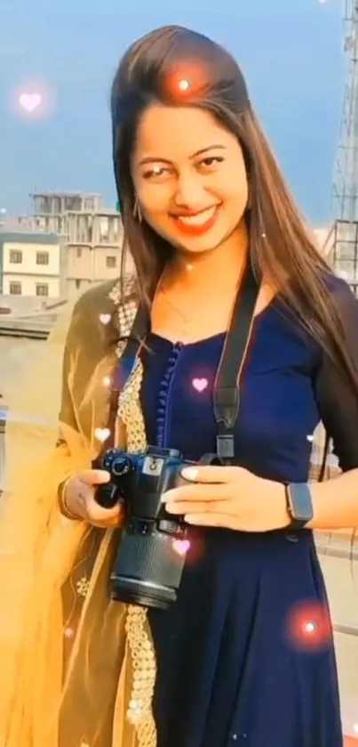 Smiling woman with a camera on a city rooftop background.