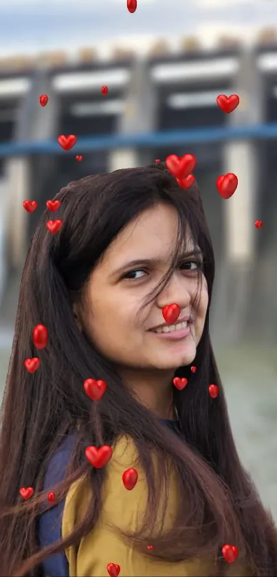 Smiling woman with red heart overlay on a blurred background.