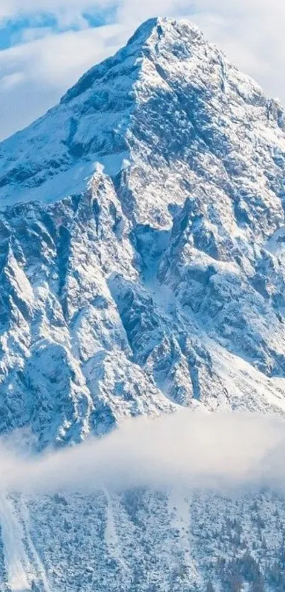 Snow-capped mountain with blue sky and clouds wallpaper.