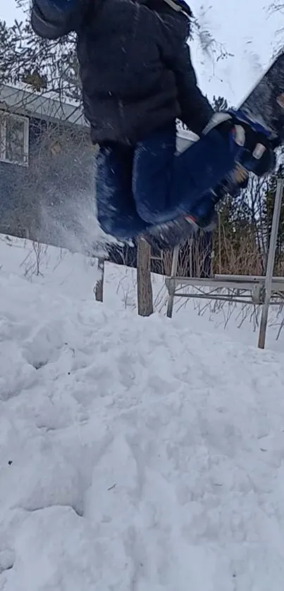 Snowboarder jumps in snowy landscape action shot.