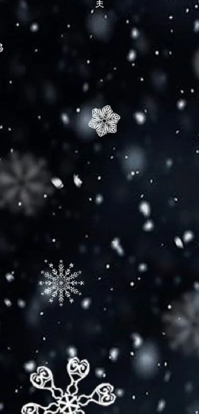 Dark wallpaper with white snowflakes scattered across a blue-black background.